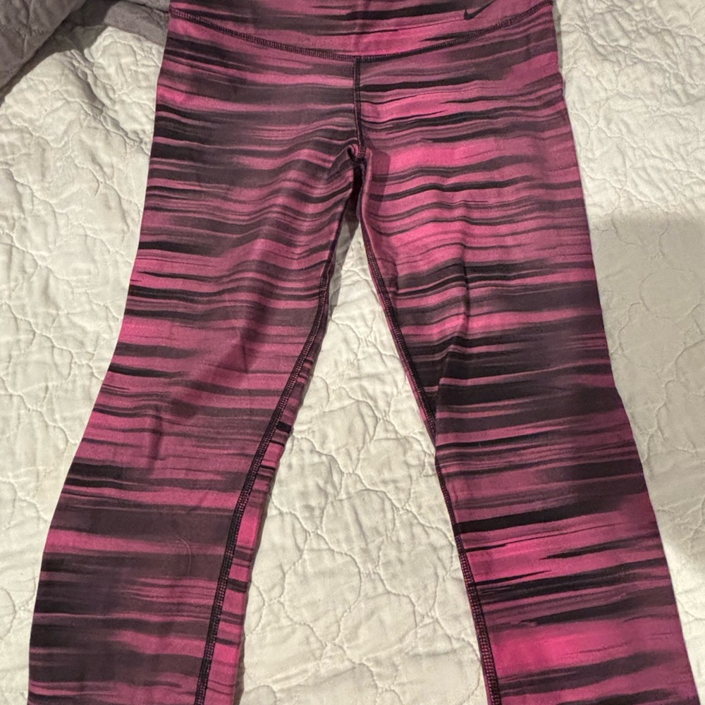 Nike Pink and Black Striped cropped leggings.